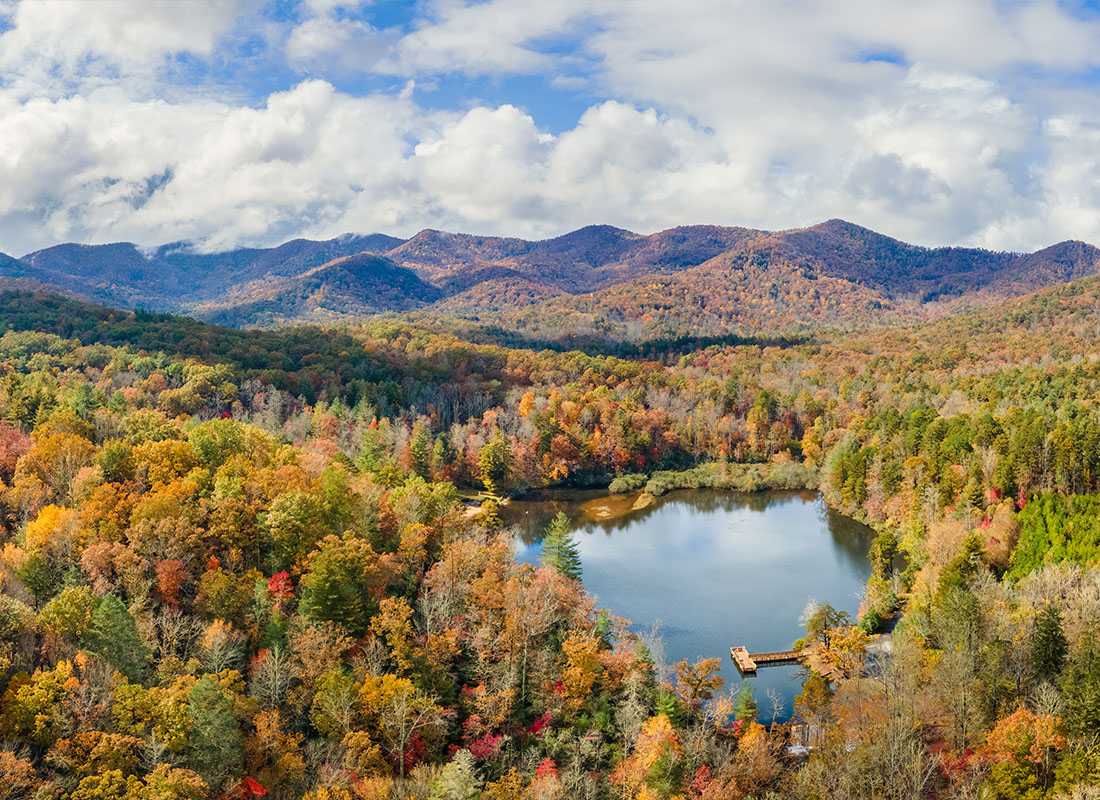 About Our Agency - Autumn View of Lake Powhatan Recreation Area Near Asheville North Carolina in the Blue Ridge Mountains